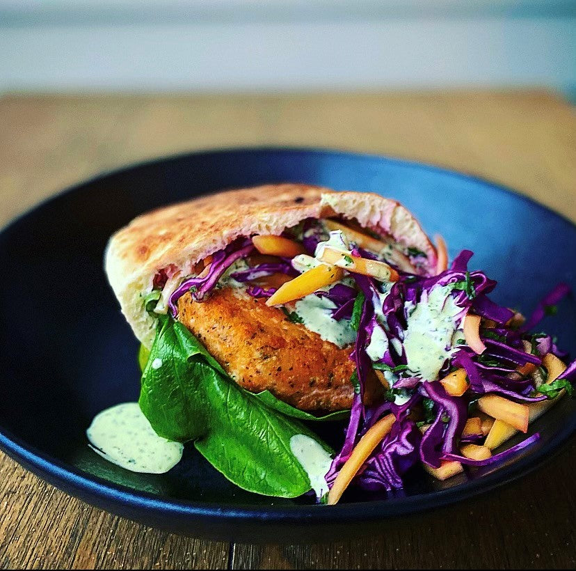 Chefs at Home: Salmon Burger Pita with Mango Slaw and Green Goddess Aioli